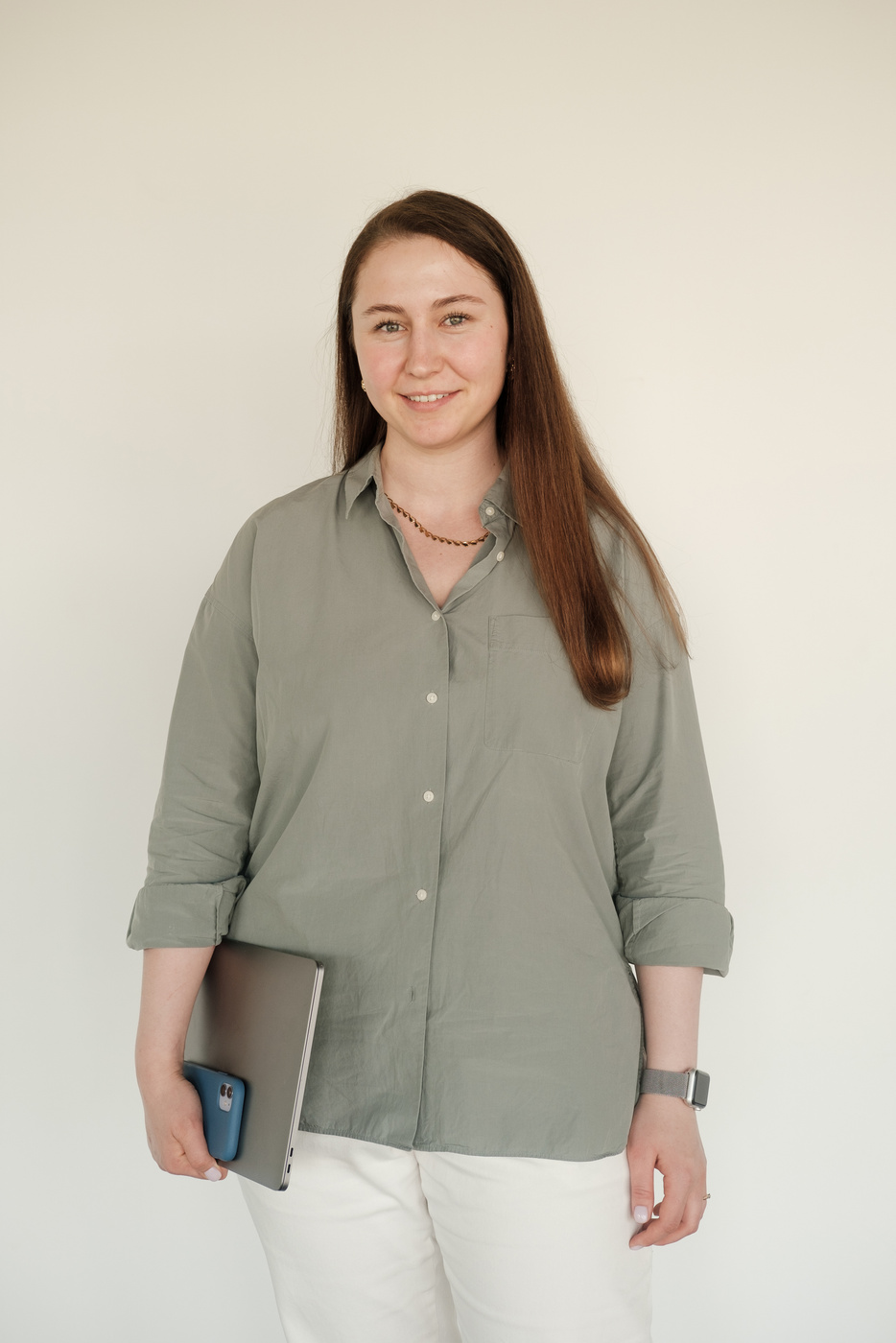 A Woman Carrying Her Laptop and Smartphone 