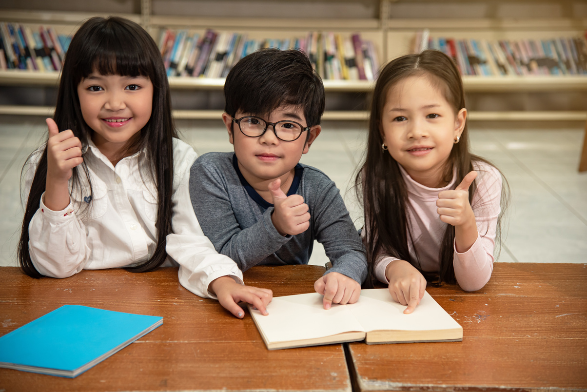 Education image,asian children happy learning in library at school.